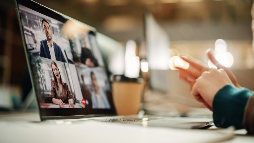 Laptop showing a group video call during an AI readiness assessment interview with several leaders on screen.