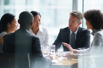 Business men and women wearing suit or formal outfit, discussing at their meeting with co-worker and client at   modern office in urban building.